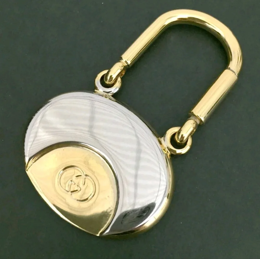 GUCCI INTERLOCKING G SILVER GOLD TONE KEY RING CHARM/UT1930 (UNISEX).